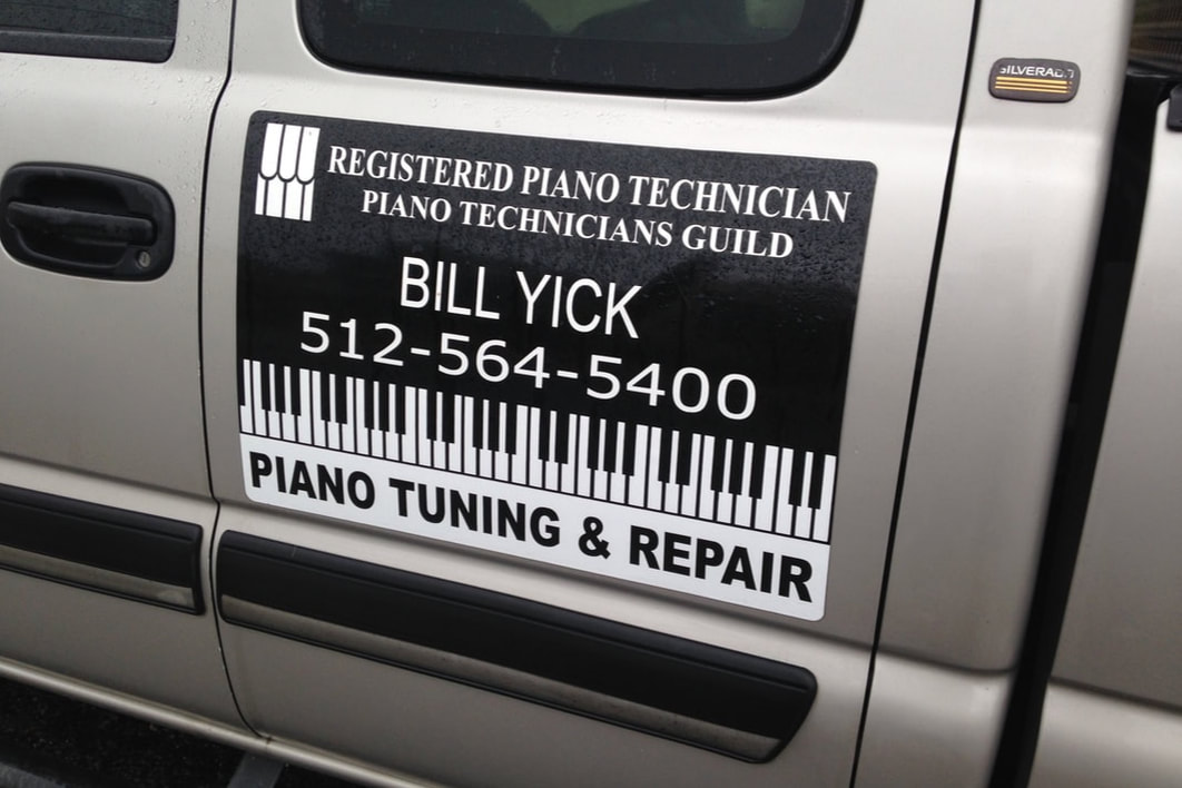 Piano tuning sign on truck